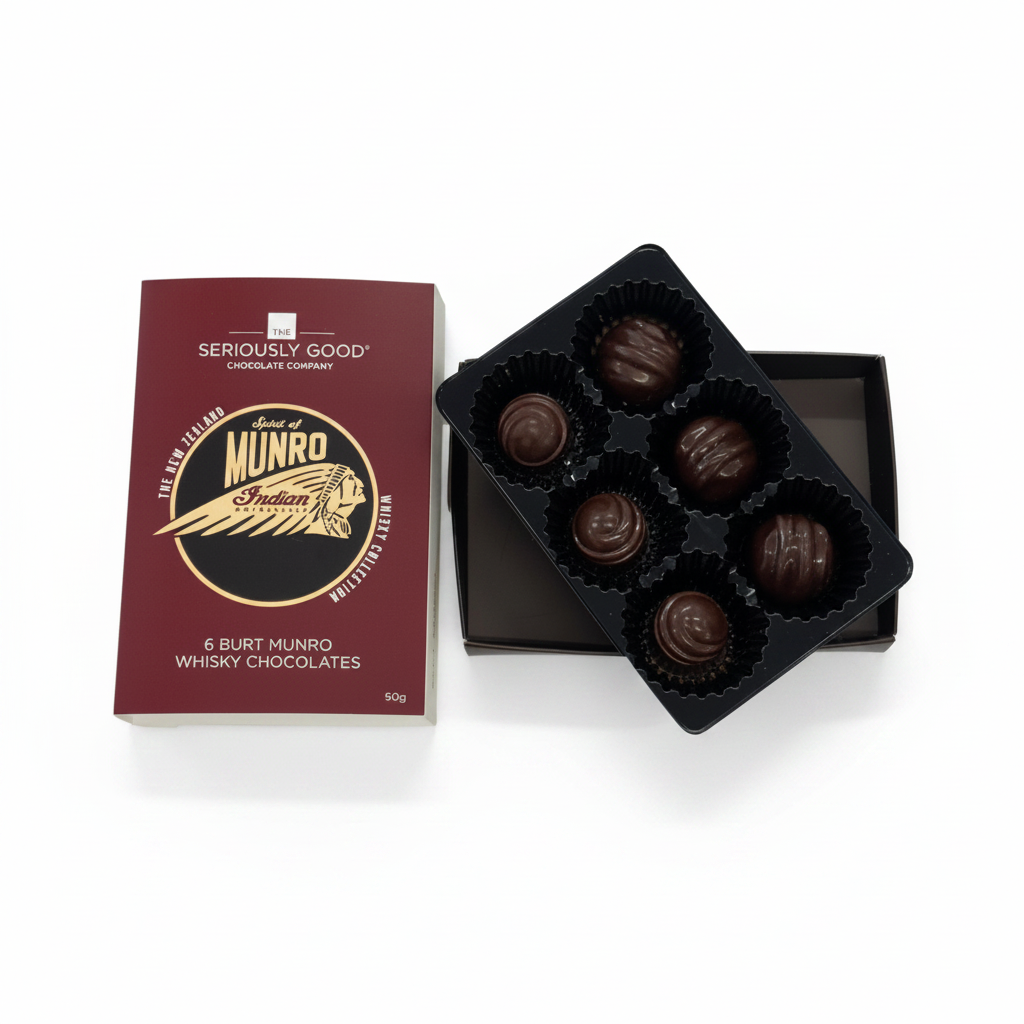 Burt Munro whiskey chocolates with packaging on a gray surface, featuring 'The Seriously Good Chocolate Company' branding.