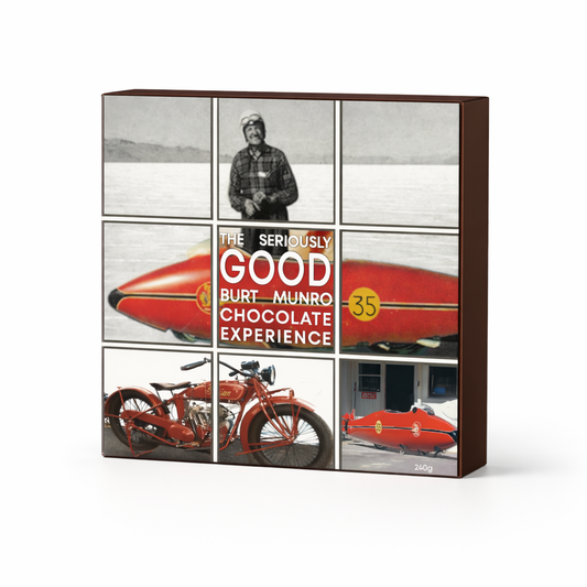 Box of chocolate with images of a vintage car and a person, featuring the text 'The Seriously Good Burt Munro Chocolate Experience'.