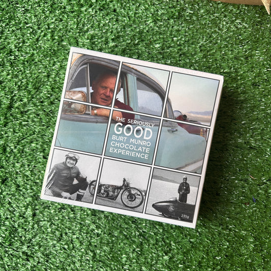 A box of chocolates with a photo of a person in a car and a motorcycle on the cover, titled 'The World's Fastest Indian'.