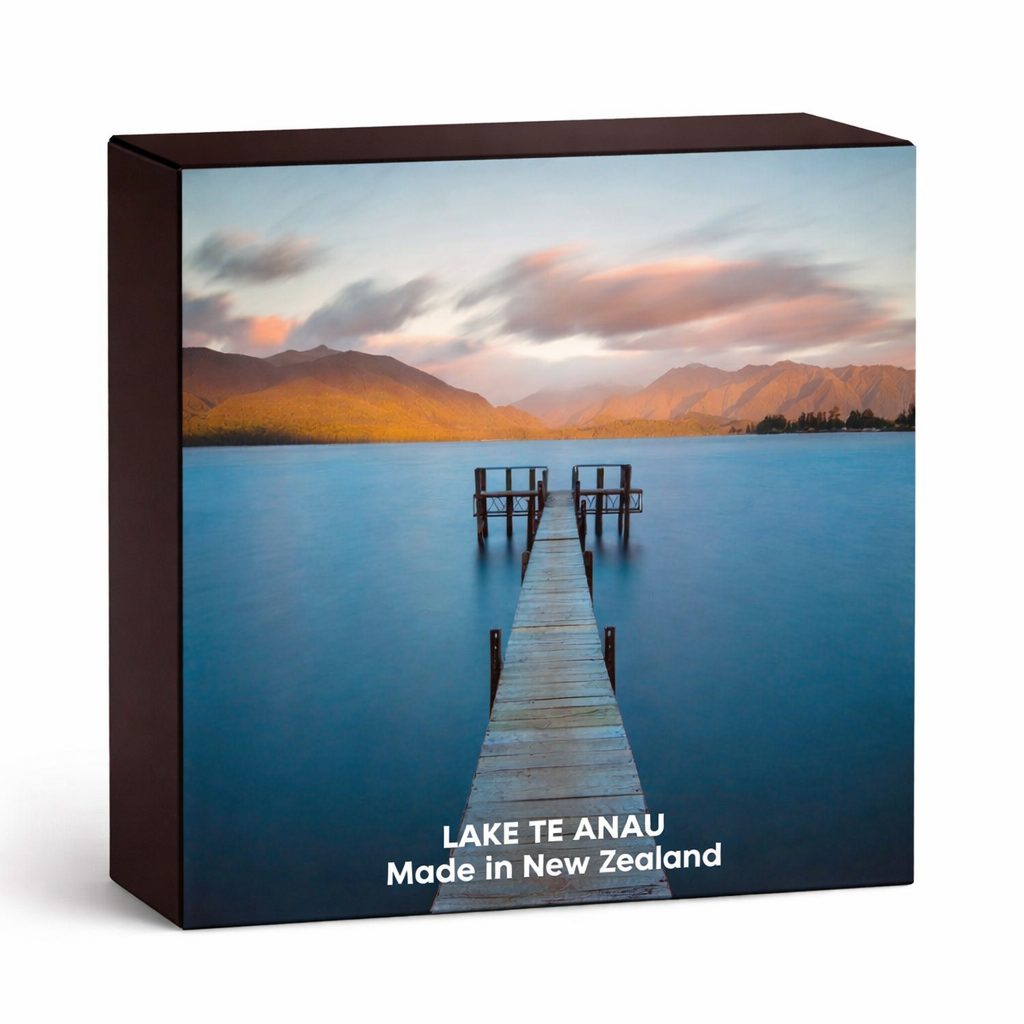 Product packaging with a scenic image of Lake Te Anau, New Zealand, featuring a dock and mountains.