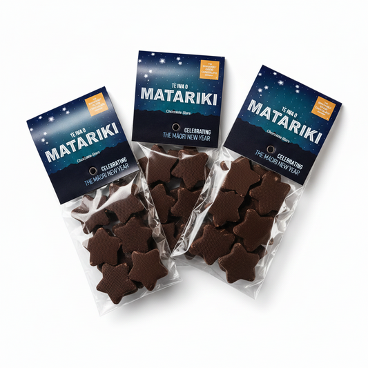 Packages of Matariki chocolate stars on a light blue background