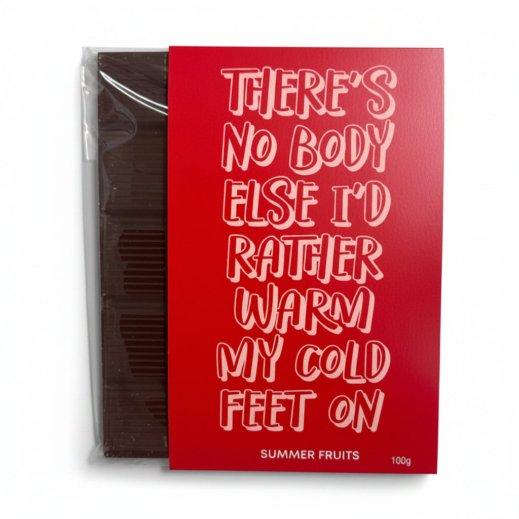 A packaged chocolate tablet with a red and white label that reads 'There's no body else I would rather warm my cold feet on' and 'My cold feet on Valentine's Day'. The packaging has a summer fruits theme.
