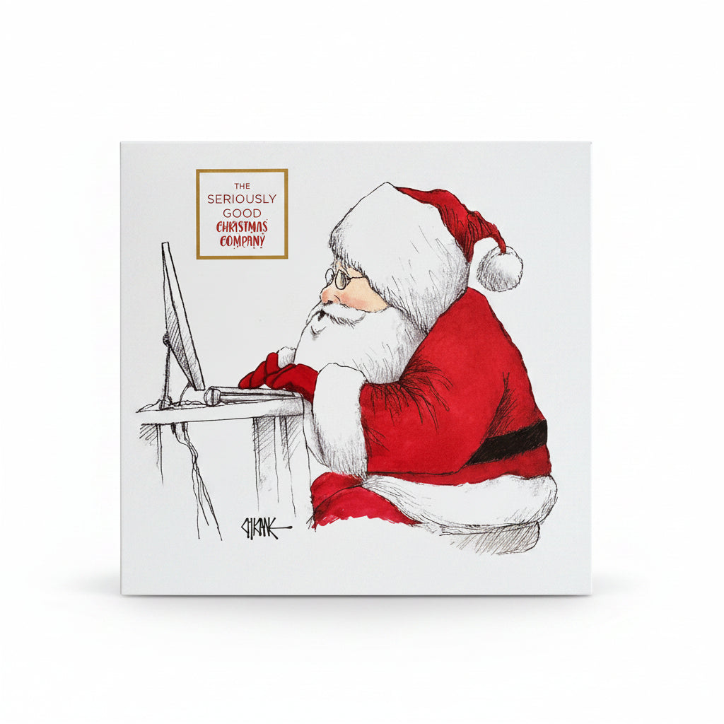 A box of chocolates with a Christmas themed illustration of Santa Claus sitting at a desk, surrounded by a forest backdrop and decorative elements.