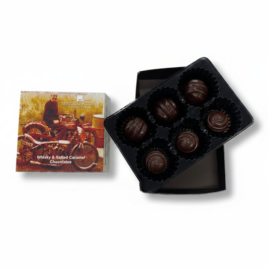 Box of chocolates with a chocolate box featuring a vintage motorcycle and 'The Seriously Good Chocolate Company' branding.