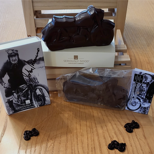The Seriously Good Chocolate Burt Munro Big Chocolate Bike packaged and unpackaged in a decorative display
