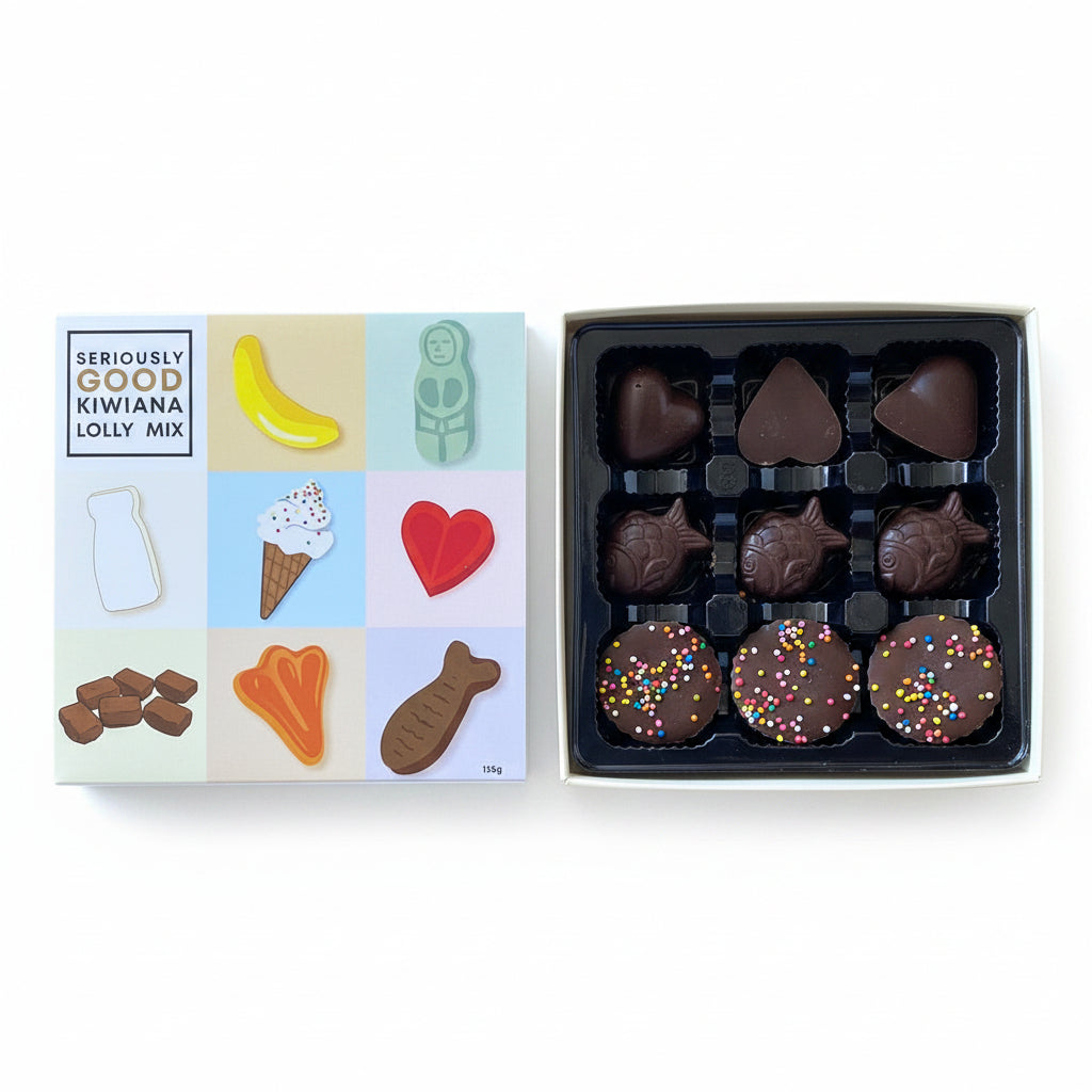 A box of assorted chocolates with a colorful packaging depicting the shapes of a banana, ice cream, heart, and other treats. Some chocolates have visible marshmallow toppings, and sprinkles.